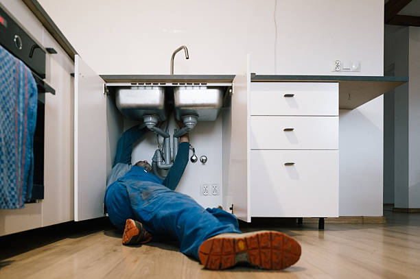 Professional Drain Cleaning technician working in Russellville, AL